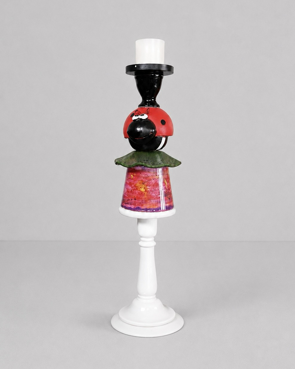 Beetle candleholder with a red-and-black beetle figure, coloured glass and white base