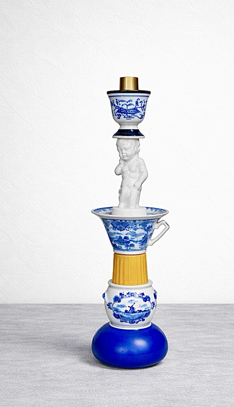 White porcelain figure in blue and white with found ceramic pieces