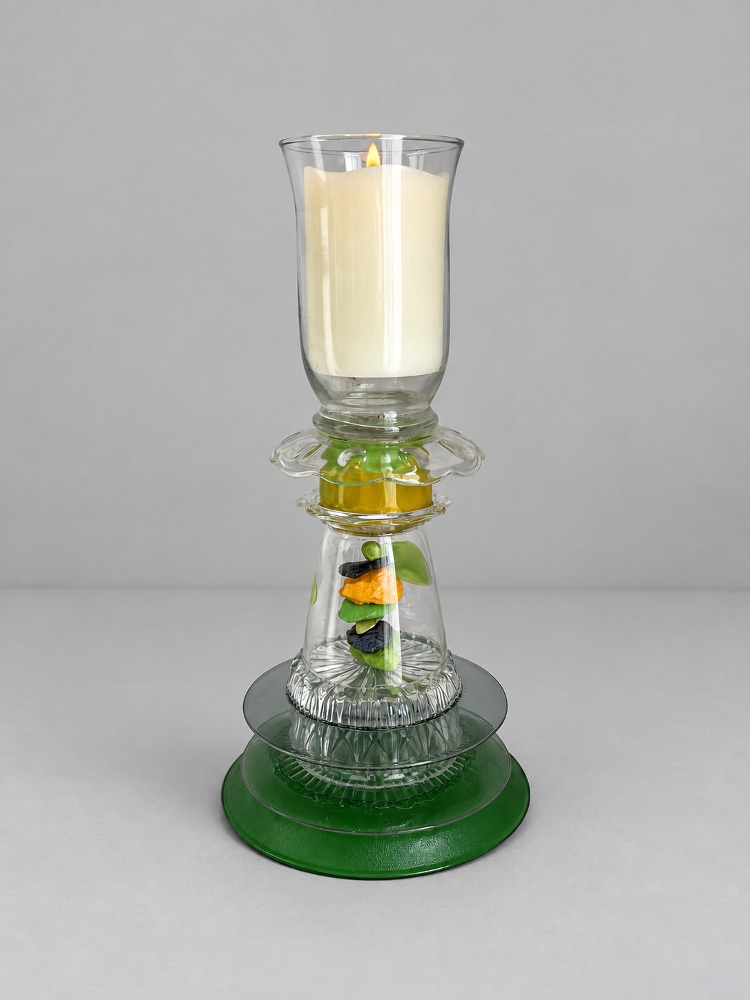 Green glass assemblage used as a candleholder
