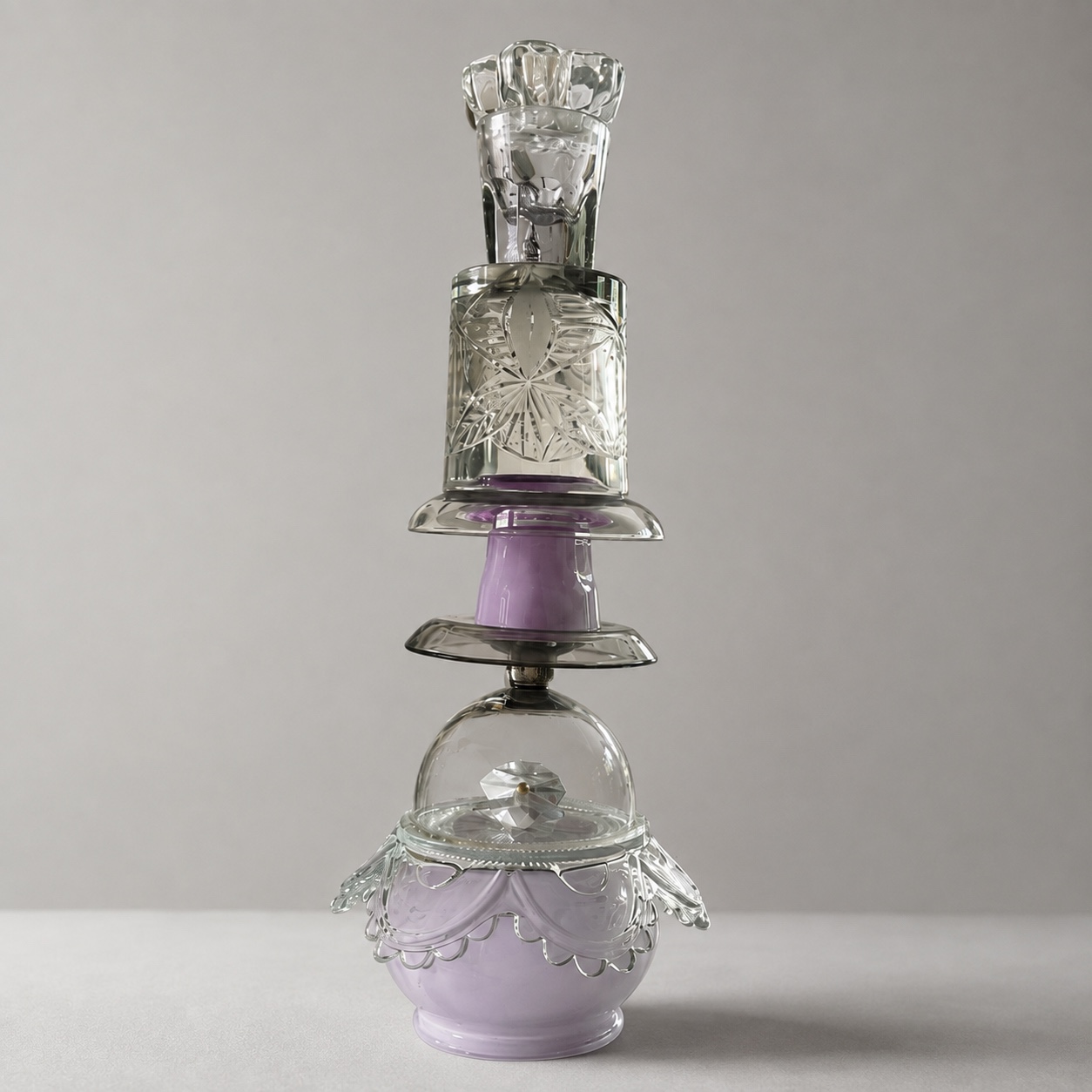 Lavender and clear cut-glass Pantomime candleholder on a pale grey background